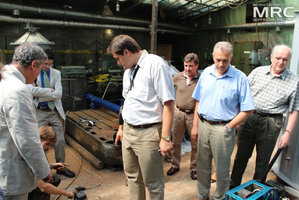 Technical discussion of project participants at MRC work premises, cheking the control system of annealing furnace, Materials Research Centre, August 2013