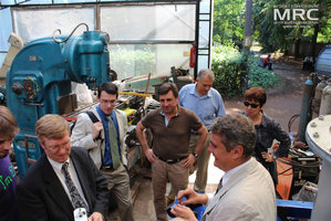 Inspecting the control units for auxilliary equipment, manufactured by MRC. from left to right: T. Moshnyaga (MRC), project technical monitor Dave Carter and Andrew Castiglioni (Argonne National Laboratory, USA), O.Gogotsi, MRC Director, project manager S.Saenko (KIPT), project manager M.Gubinskyi (NMetAU), I.Tomashevskaya (STCU), Materials Research Centre, August 2013